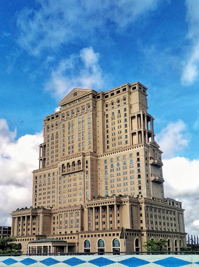 Mastering the First Impression: Your intriguing post title goes here Majestic view of the ITC Royal Bengal Hotel in Kolkata under a vibrant blue sky.